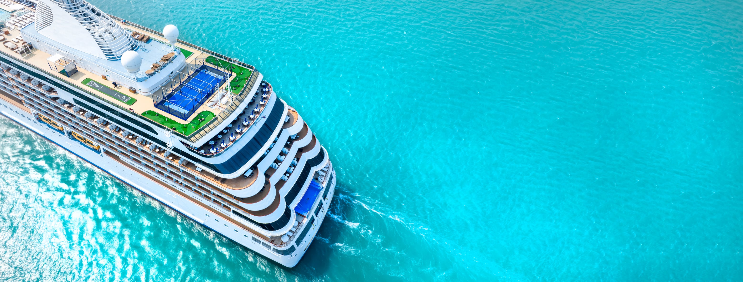 Aerial view of cruise ship on turquoise ocean